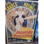 Film posters, one sheet Diamond Horseshoe, folded and framed, together with reproduction Casablanca,