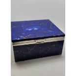 A George VI silver and lapis lazuli box, the hinged lid with silver framework marked London 1930,