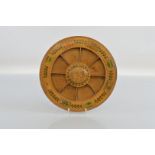 A Regency sycamore "Pope Joan" gaming wheel, with lift off central roundel and segmented design,