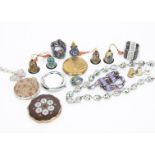 A collection of costume jewellery, including cloisonne beads, various papier mache bells, compacts