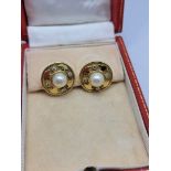 A pair of 18ct gold pearl and diamond roundel earrings, centred with pearls surrounded by four