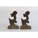 A pair of Dryad bronze bookends, with stylised leaping fish on stepped bases, 13cm high x 7.5cm
