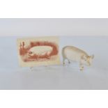 A Beswick matt glaze model of a pig, together with a Shire Postcard of a Small White Boar (2)
