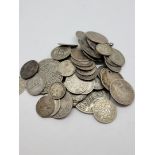 A collection of British and world silver coins, including some half silver florins, three pences,