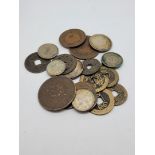 A small collection of Asian coins, various metals, silver and copper, some with holed centres