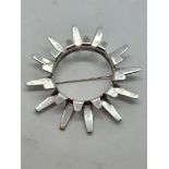 A Norwegian silver star brooch, by Tone Vigeland of Fredrikstad, with radiating prongs to open