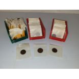 A collection of British and World loose coins, all in wax paper packets, including a collection of