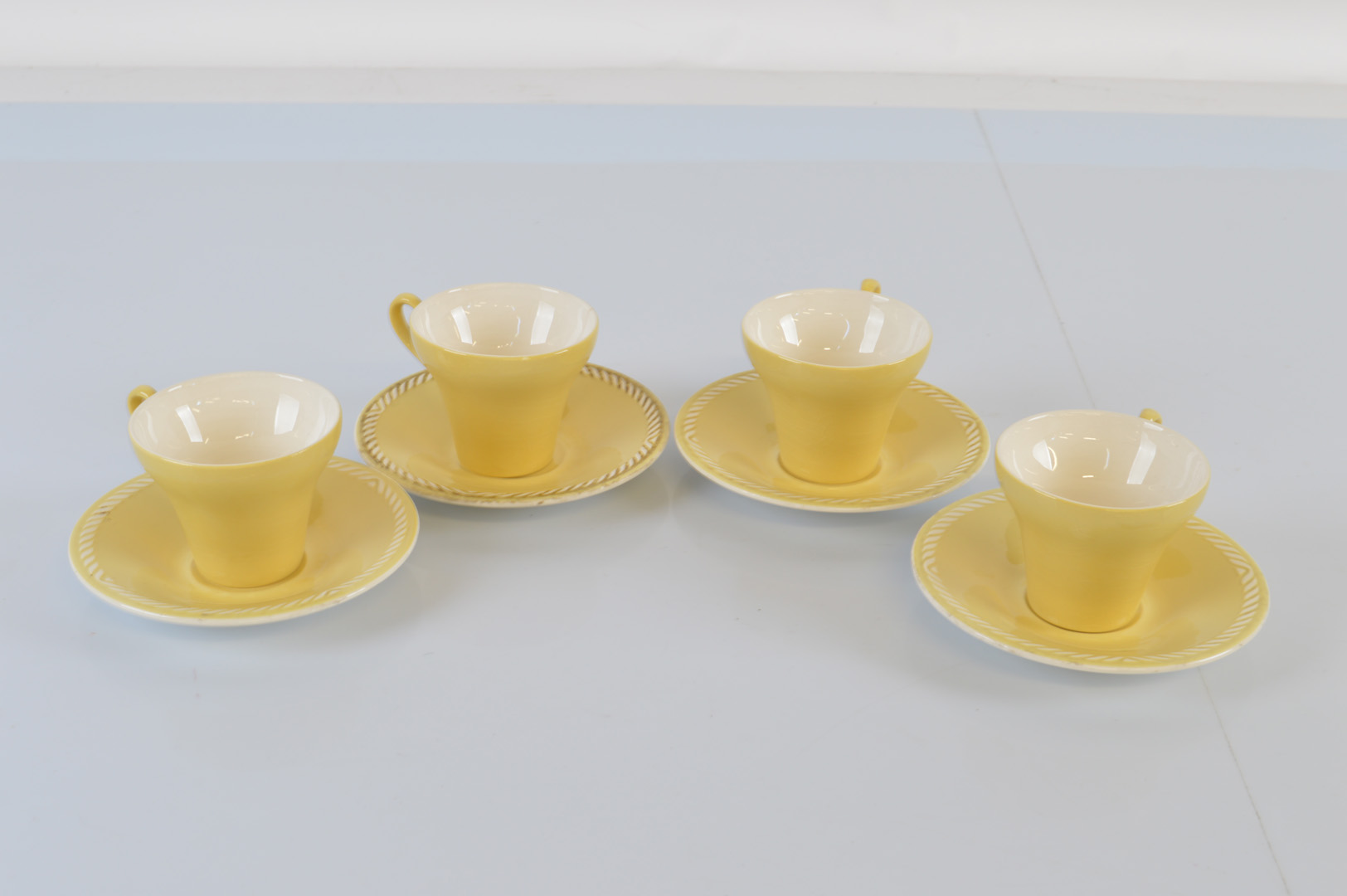 A Norwegian Figgjo Flint four person coffee can and saucer set, in yellow, one can af