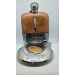 A presentation silver plated glass and leather hip flask, dated June 5th 1923, 17cm x 11cm