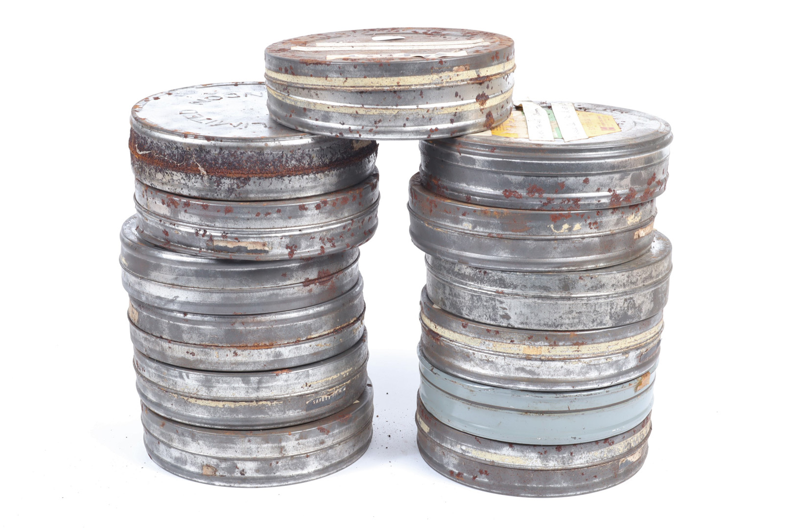 Canisters of 28mm Cine Film, marked with titles, Higher than Love, Walls + Wallops, Magnetism,