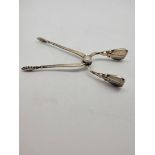 A pair of silver Georg Jensen sugar tongs, 10cm, stylised flower head thumb rests, 30g