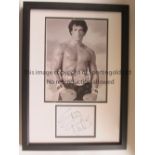 SYLVESTER STALLONE AUTOGRAPH A framed and glazed picture of Stallone as Rocky with a championship