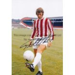 AUTOGRAPHED GEOFF HURST 1973 Photo 12" x 8" of Hurst demonstrating his footballing skills for