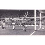 ARSENAL / MALCOLM MACDONALD AUTOGRAPH An original 11" X 7" B/W Press photo of MacDonald scoring