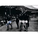 MAURICE SETTERS Autographed 12 x 8 B/W photo showing Man United players parading the FA Cup around