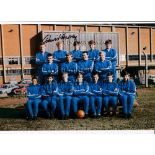 LEEDS UNITED Autographed 12 x 8 photo showing players in their all blue tracksuits posing for a