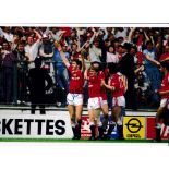 NORMAN WHITESIDE Autographed three colour 12 x 8 photos, showing Whiteside celebrating & holding