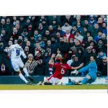 JERMAINE BECKFORD Autographed 12 x 8 colour photo showing the Leeds striker scoring the winner