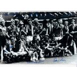 MAN UNITED Autographed 12 x 8 B/W photo showing players celebrating with the FA Cup following