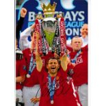 RYAN GIGGS Autographed 12 x 8 colour photo showing Giggs holding aloft the Premiership trophy