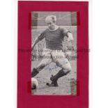 BOBBY CHARLTON AUTOGRAPH A b/w signed magazine picture mounted on card with tape in each corner.