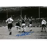 GEOFF HURST Autographed 12 x 8 b/w photo showing the West Ham striker celebrating after equalising