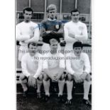 GARY SPRAKE Autographed 12 x 8 b/w photo of Sprake and several team mates posing for photographers