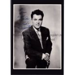 DICKIE VALENTINE AUTOGRAPH A 10" X 7.5" b/w mounted photo of the 1950's British pop star, with a