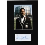 SIR GARFIELD SOBERS AUTOGRAPH A colour photo and blue hand signed card mounted on black card. Good