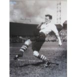 TOM FINNEY AUTOGRAPH A 16 x 12 b/w photo of the Preston winger warming up in front of