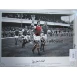 FRANK McLINTOCK AUTOGRAPH A 16 x 12 colorized limited edition of the Arsenal captain holding aloft