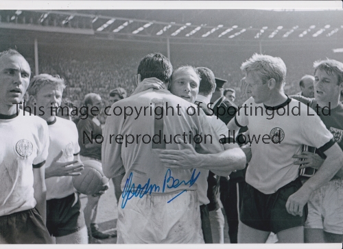 GORDON BANKS Autographed 12 x 8 b/w photo of the West German captain Uwe Seeler embracing the