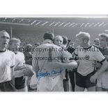 GORDON BANKS Autographed 12 x 8 b/w photo of the West German captain Uwe Seeler embracing the