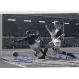 MAN UNITED Autographed 12 x 8 b/w photo of goalkeeper Harry Gregg scrambling to gather the ball that