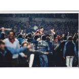 BRYAN ROBSON Autographed 12 x 8 col photo of the Man United captain being chaired by celebrating