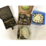 A collection of clock parts including cogs, clock