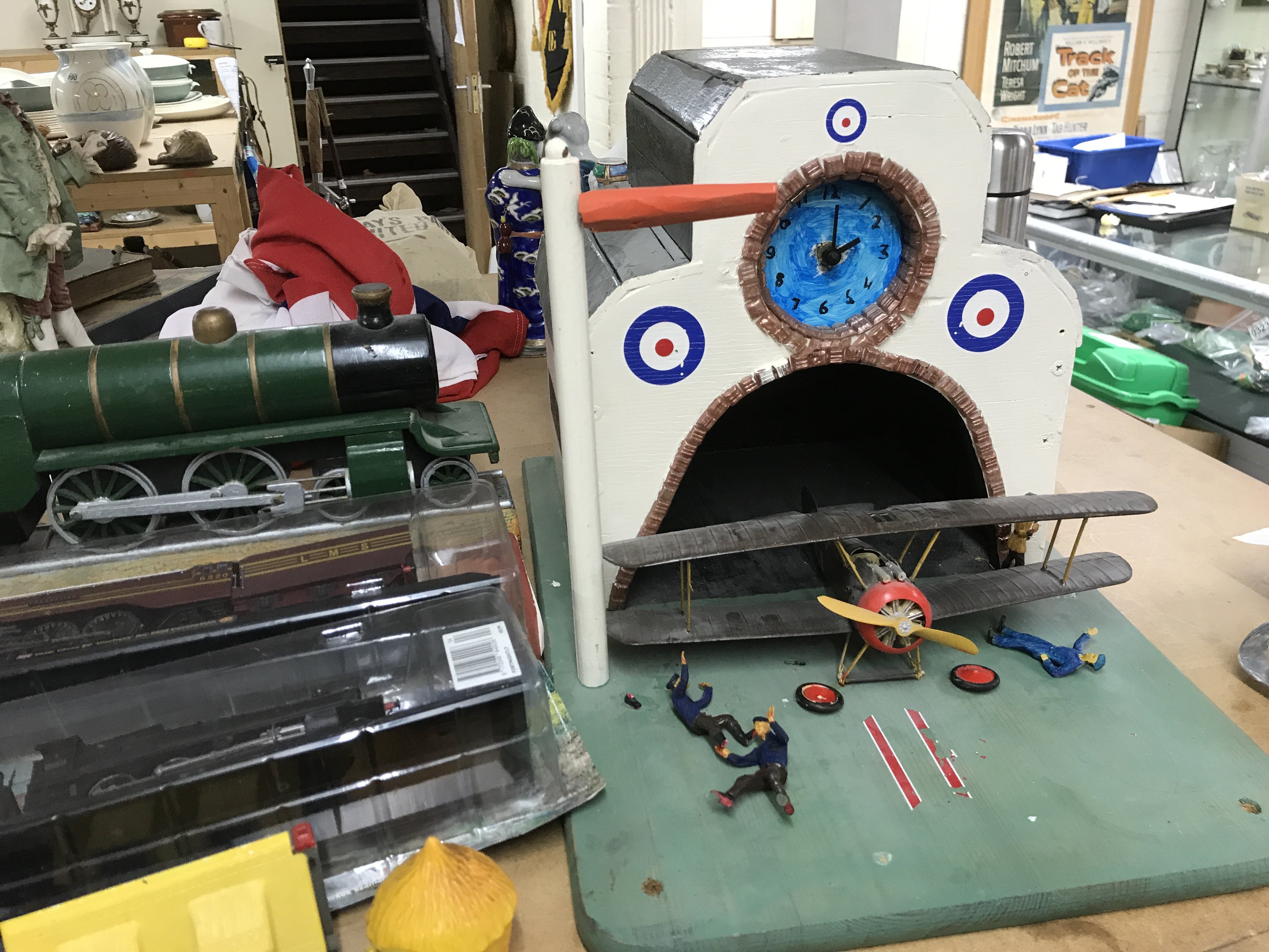 A vintage home made model aircraft hanger and bi-p