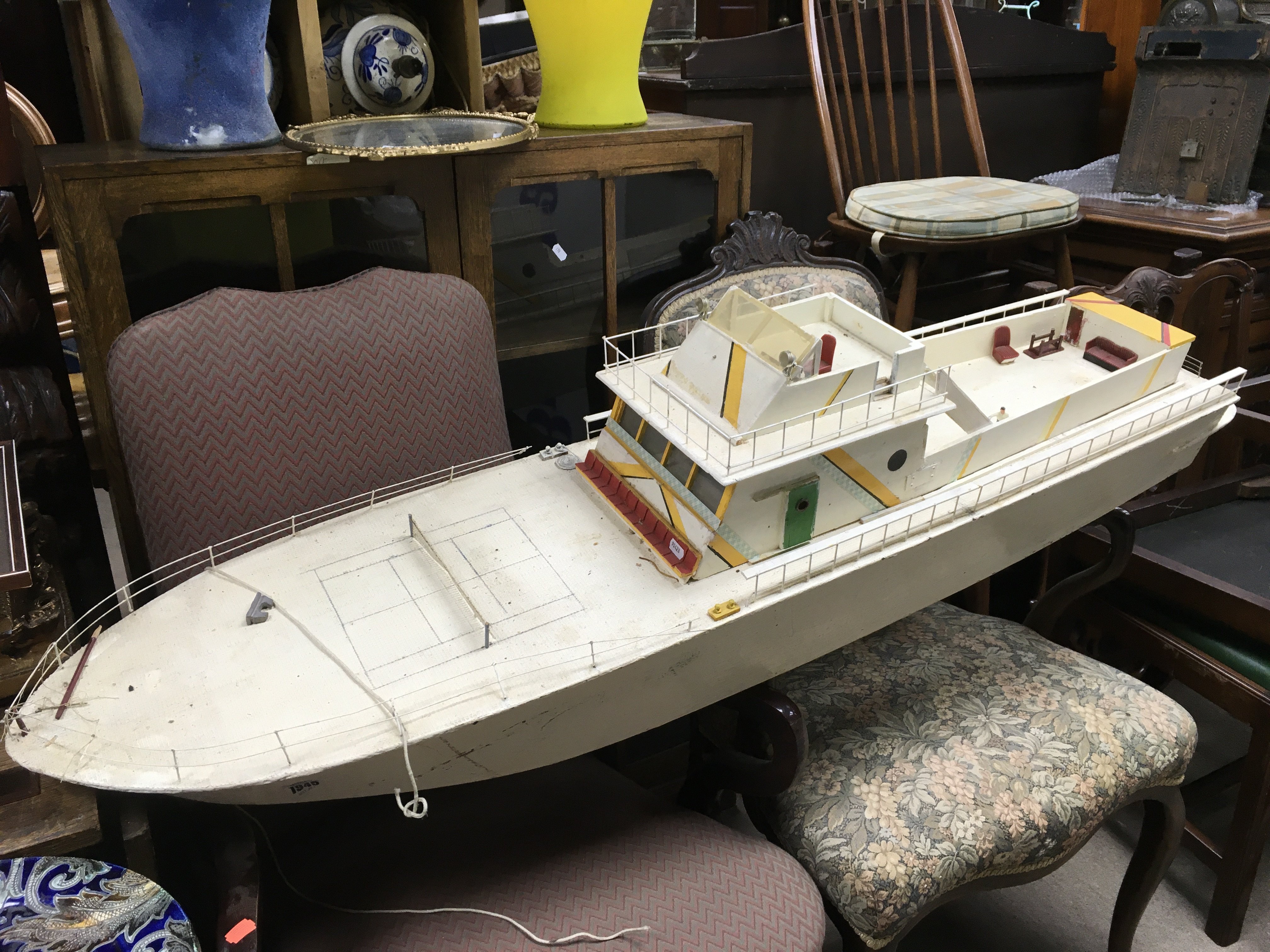 A scratch built motorised model boat, in need of r