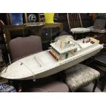 A scratch built motorised model boat, in need of r