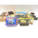 A collection of games including Meccano, dominos,