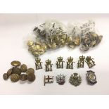 A collection of military badges and buttons.