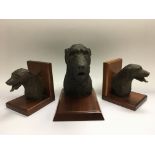 A collection of resin figures and bookends of wolf