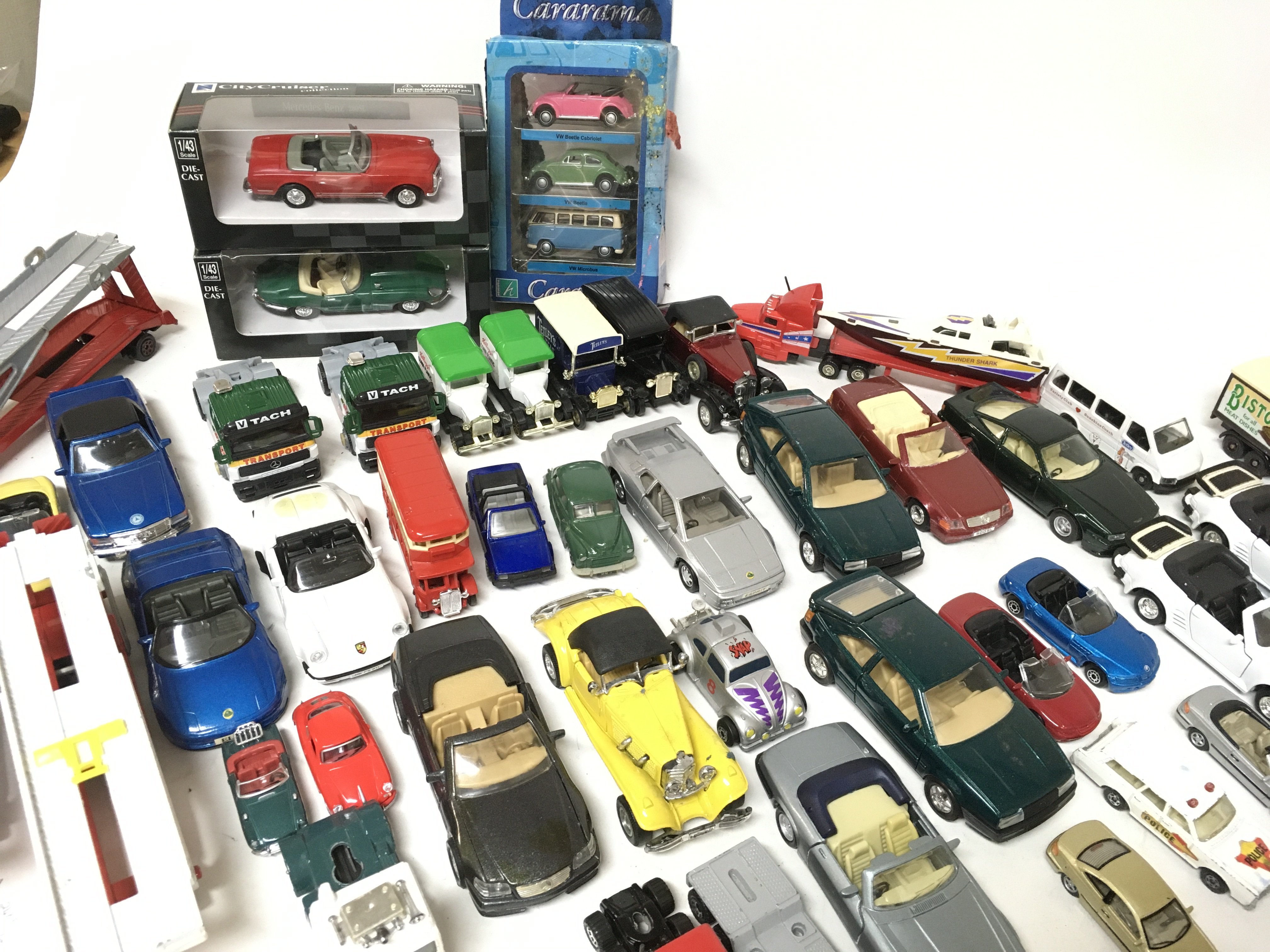 A collection of die cast cars and vehicles includi