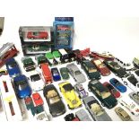 A collection of die cast cars and vehicles includi