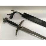 An ornamental sword and scabbard, the hilt and pom