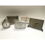 Five vintage alarm clocks including Metamec and Sm