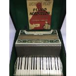 A cased Hohner accordion.