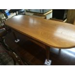 A modern design teak two tone coffee table possible G-Plan with an oval top on square legs. Length