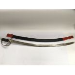 An Indian ceremonial sword and scabbard. NO RESERV