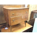 A modern design teak chest of drawers with two drawers on splayed legs. 67x71cm